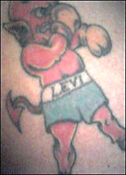 Levi Bellfield's tattoo with the 'tail of a dragon'.